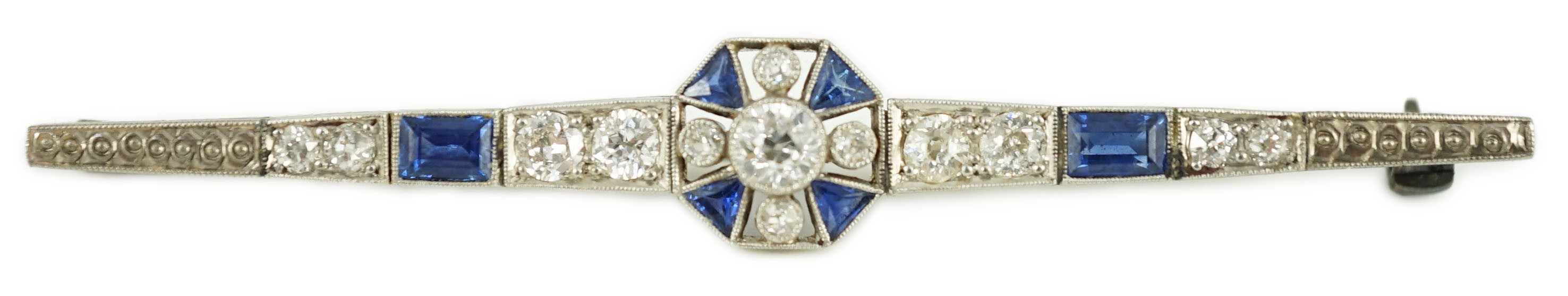 A 1920's/1930's white gold, sapphire and diamond cluster set bar brooch